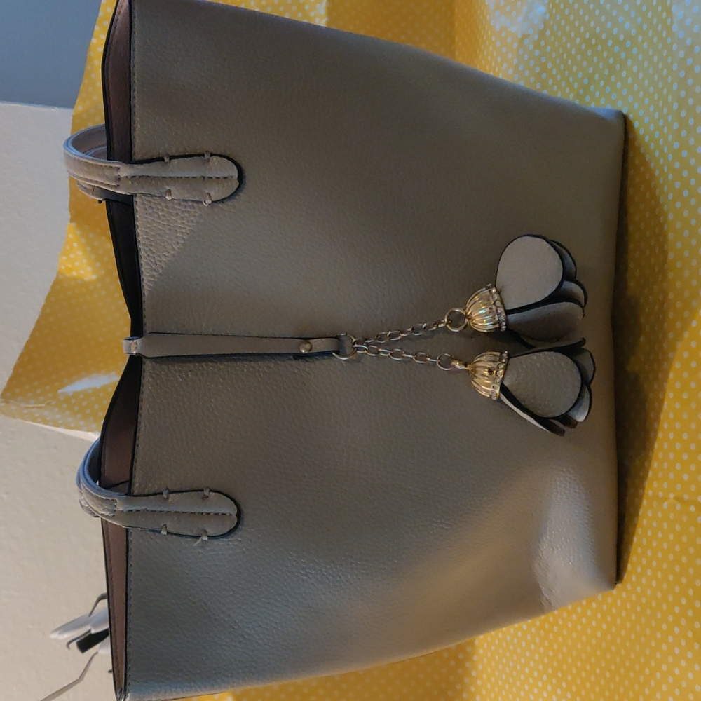 Reversible pink and tan tote with flower tassels